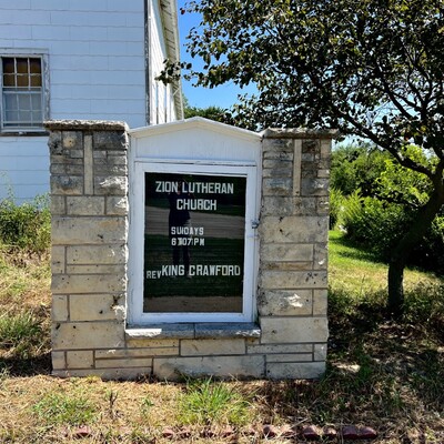 Sign at Zion Lutheran cleaned up