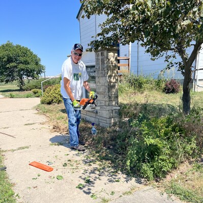 Dr. Richard Wendt cutting trees at Zion Lutheran Church