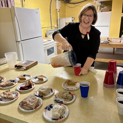 Board member, Jo Ellen Whitehair, serving up dessert and beverages!