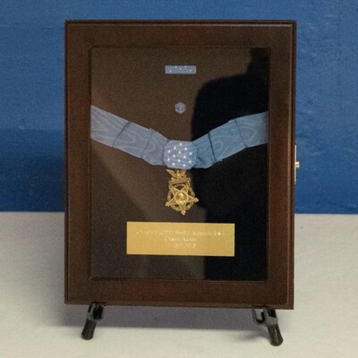 Father Kapaun received the Medal of Honor posthumously, awarded by President Obama in 2013. His nephew, Ray Kapaun, accepted the award on his behalf.