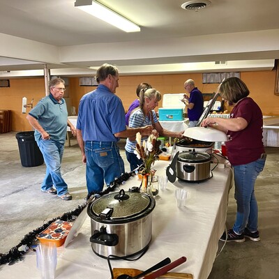 Board member Jo Ellen Whitehair serving chili